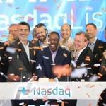 Rapid7 chief executive Corey Thomas, center, and other Rapid7 employees rung the opening bell at the Nasdaq stock exchange on Friday.